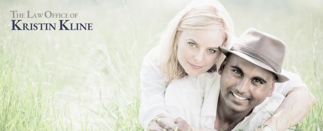 Happy couple embracing in a grassy field, symbolizing a committed relationship under Texas common law marriage.