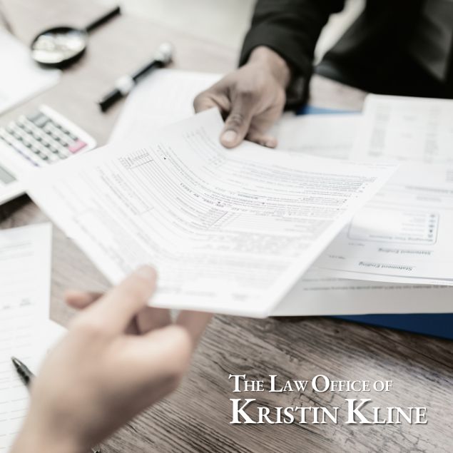 Attorney reviewing discovery documents during Texas divorce