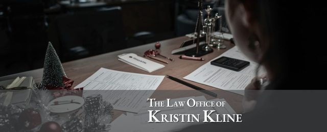 Attorney reviewing will and power of attorney documents in Houston office