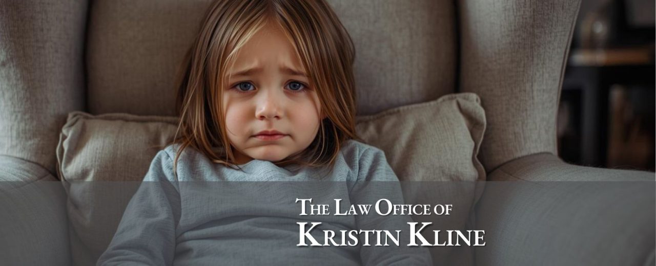 Child looking concerned while sitting on a couch, representing the emotional impact of parental alienation in custody disputes, with branding for the Law Office of Kristin Kline.